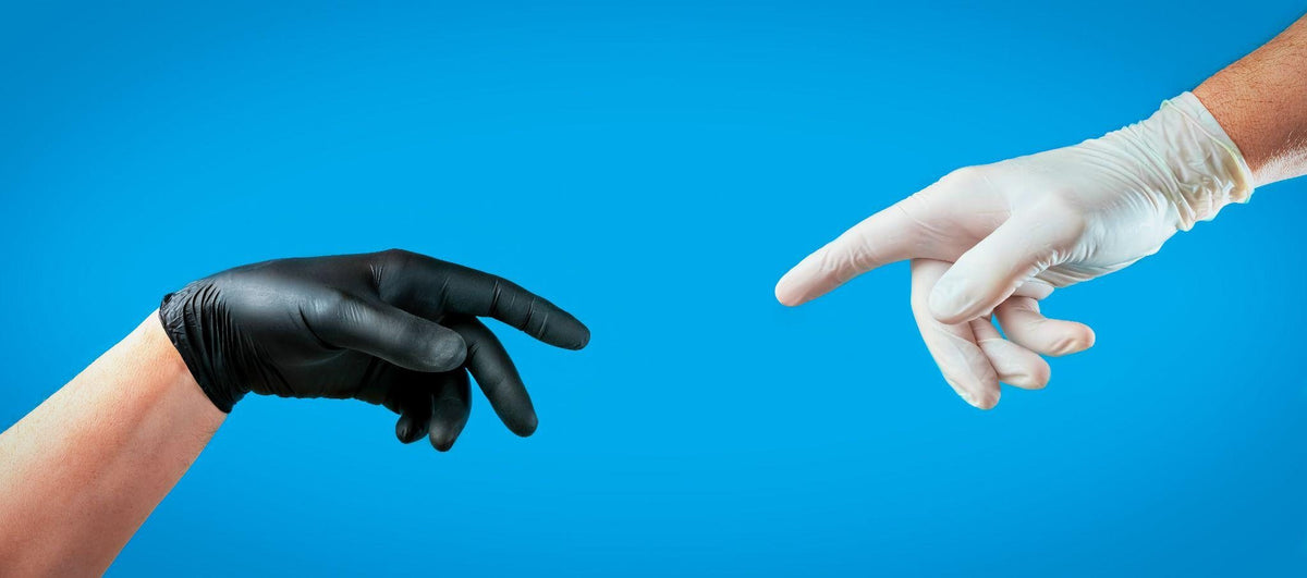 Black nitrile glove and white latex glove compared