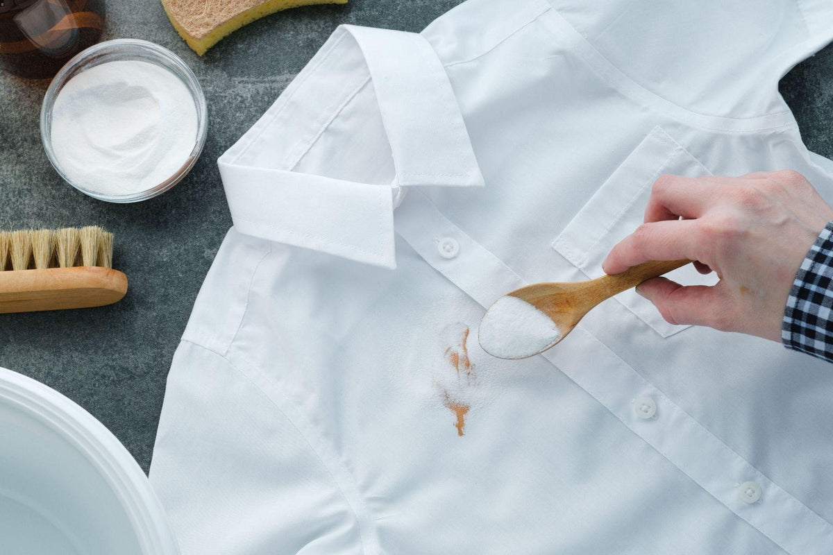 Treating a stain on a white shirt before washing