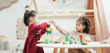 kids playing with blocks on a table
