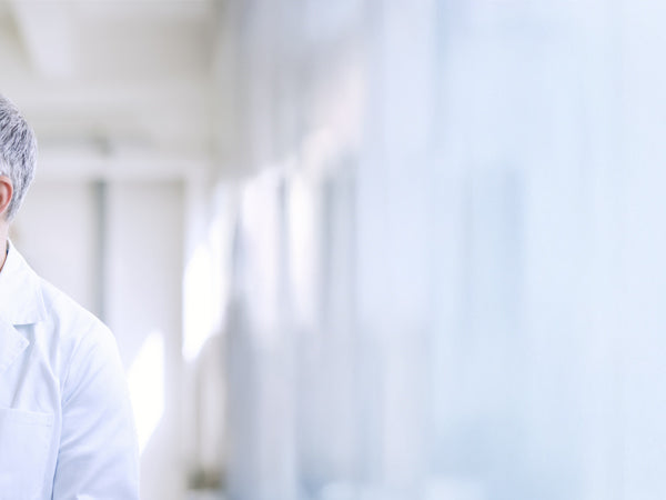 A pharmacist managing pharmaceutical inventory and medicine stock on warehouse shelves