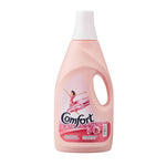 Comfort fabric softener bottle in Pink Passion scent, featuring a light pink plastic bottle with a white cap and a label depicting a dancer in a pink dress.